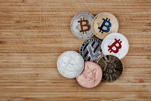Digital currency physical gold and silver coins. Bitcoin, Dogecoin, Litecoin.