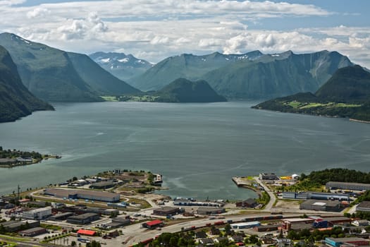 Panoramic view of the mountains around Andalsnes in Norway under a sunny sky in Romsdalsfjorden