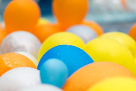 color balloons floating in a pool