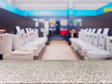 Marble empty table in front of blurred DIY supermarket background. Mock up for display of product.