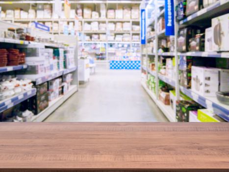 Brown wooden board empty table in front of blurred background. Perspective dark wood over blur in supermarket - can be used for display or montage your products. Mockup for display of product.