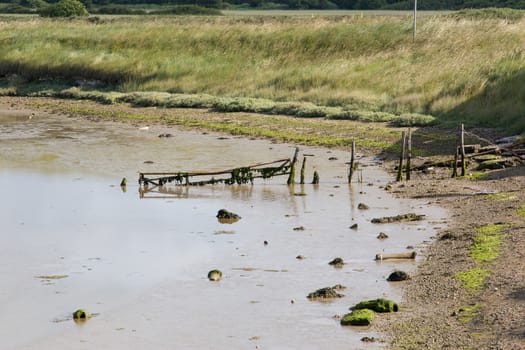 Low tide with exposed mud at Newhaven Tide Mills, in East Sussex