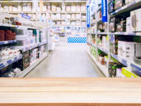 Light wooden board empty table in front of blurred background. Perspective light wood over blur in supermarket - can be used for display or montage your products. Mockup for display of product.