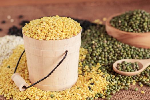 Soybeans in buckets and other on table.