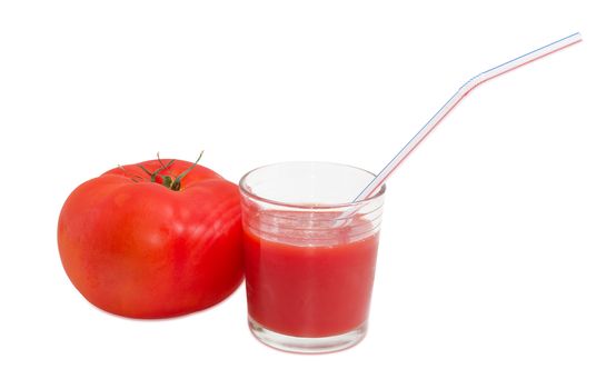 Fresh ripe tomato and tomato juice in glass with bendable drinking straw on a light background
