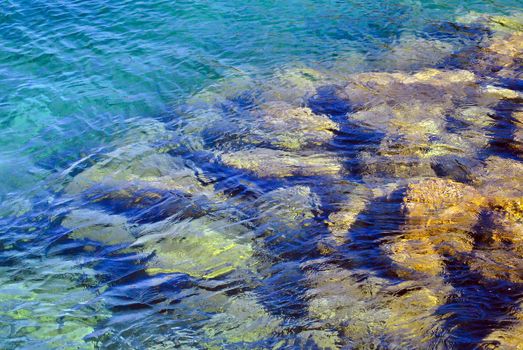 Transparent water of the mediterranean sea and stones under the clear water