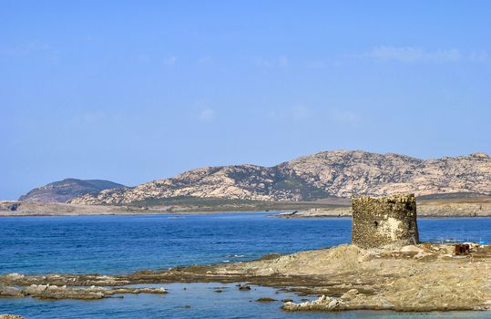 Amazing view of the famous La Pelosa Beach with the landmark 16th century Watchtower (Torre della Pelosa)