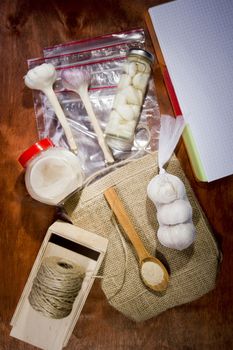 Varied garlic package on a wooden background