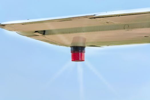 Wing of an airplane with position lighting.