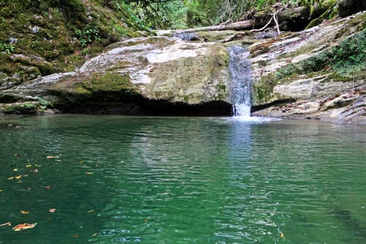 Small hadzhipse scenic river waterfall in the North Caucasus mountains.