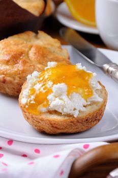 bun with   cheese cottage orange   jam for breakfast