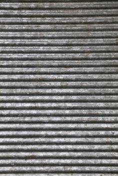 Corrugated goffered gray galvanized metal sheet background texture (washboard, skiffle board)