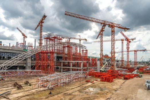 Construction Cranes Working on Expressway Site in Asia