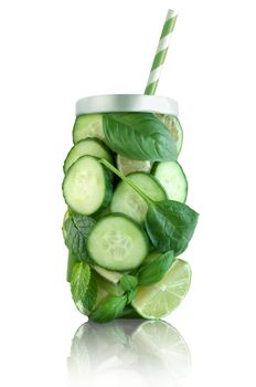Healthy green fruits and vegetable in the shape of a jar with straw 