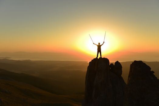 successful climber on the rocks