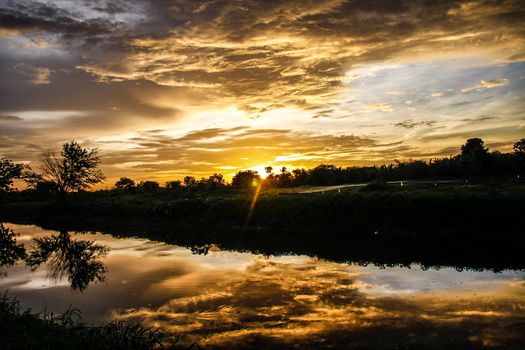 orange sky reflect on canal in evening