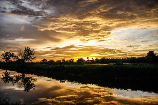 orange sky reflect on canal in evening