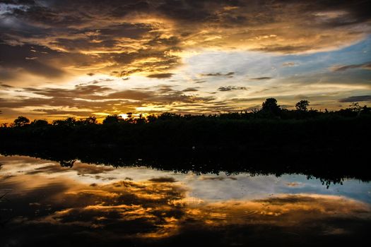 orange sky reflect on canal in evening