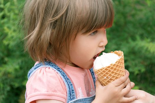 Horizonta photo of cute girl are eating icecream in summer time