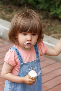 Photo of cute girl are eating icecream in summer