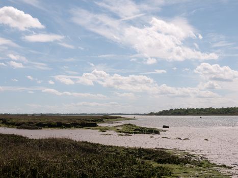 a river side and bank scene with no people beautiful looking nature landscape on a sunny day heaven and peace outside country essex england uk