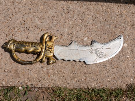 a child play toy sword outside