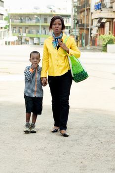 This young woman and her child are walking down the street without worry.