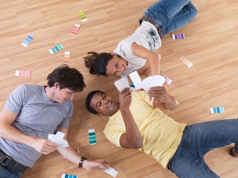 Group of friends choosing paint colours