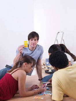 Group of friends choosing paint colours