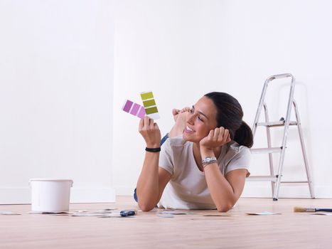 Girl choosing paint colours