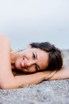 Woman laying on the beach