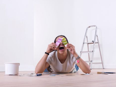 Girl choosing paint colours