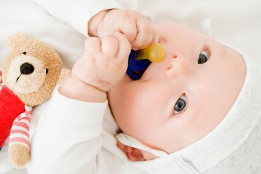 Baby nibbling on pacifier