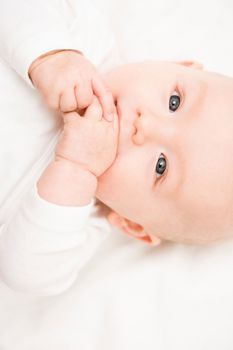 Baby smiling into camera