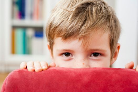 Young boy hiding