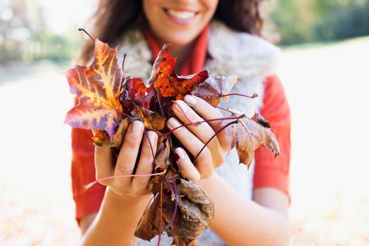 young woman showing leaves