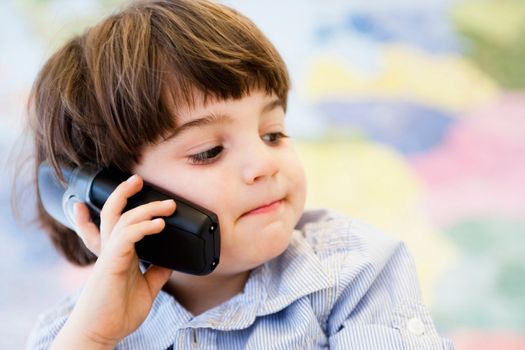 young boy phoning