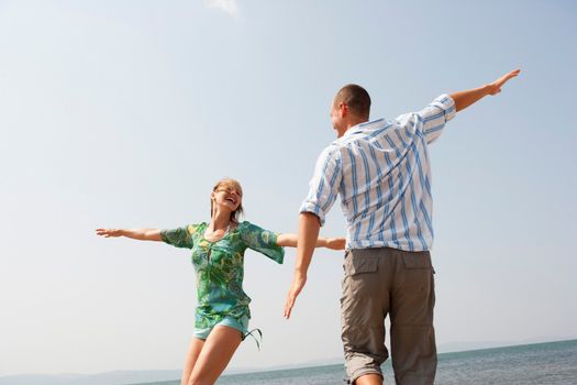 Young Couple Playing Air Plain