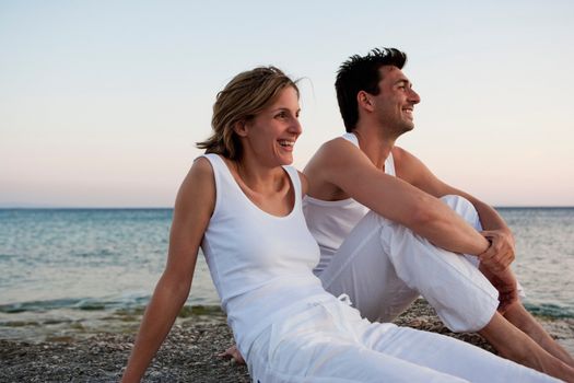 Couple Relaxing At Beach