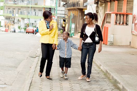 This family , together made a little walk in the street