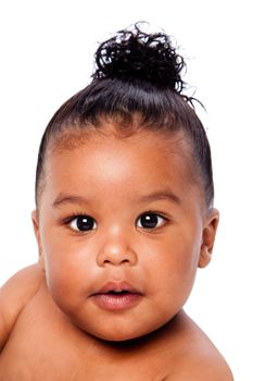 Face of beautiful cute baby toddler with hair in bun.