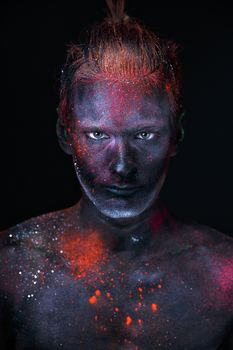 Conceptual shot of light and shine fluorescent  colors young man's face