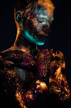 Conceptual shot of light and shine fluorescent  colors young man's face