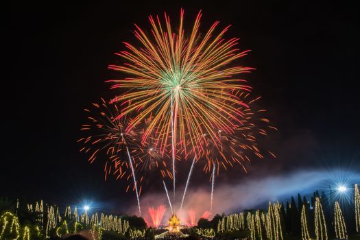 Beautiful display of colorful fireworks, Fireworks on night sky at Ho Kham Luang at Royal Park Rajapruek in Chiangmai,Thailand