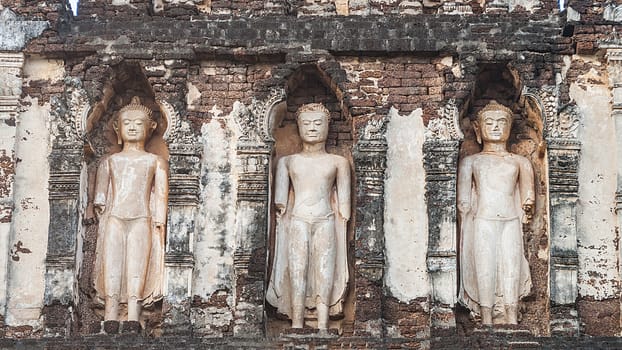 Standing Buddha Buddha of brick and mortar in Wat Cham Thewi temple in Lamphun, Thailand