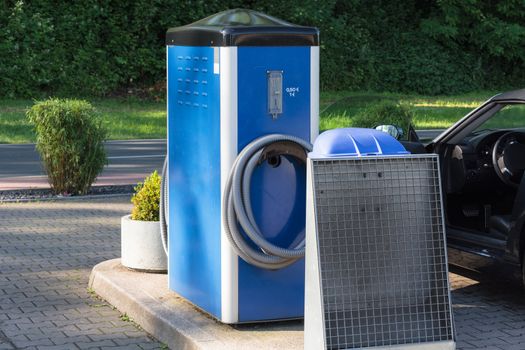 Stationary vacuum cleaner for car cleaning at a public car washing machine.
