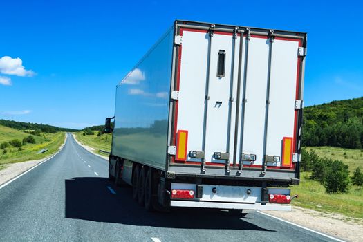 Picture of big truck with the trailer moves on the highway