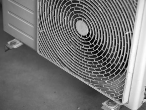 BLACK AND WHITE PHOTO OF CLOSE-UP PATTERN OF AIR COMPRESSOR SAFETY GUARD