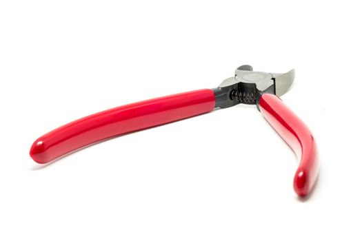 Red open and handled pliers  on a white background.Tools series.