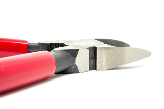 Red open and handled pliers  on a white background.Tools series.